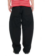 PP Buck Pants, Black – close-up on model, lower body